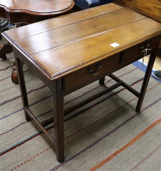 A George III oak side table W.84cm